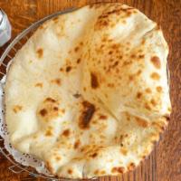 Naan · Leavened white bread baked in clay oven.