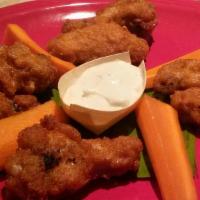 Caribbean Wings · 8 caribbean seasoned wings served dry with carrots and celery.