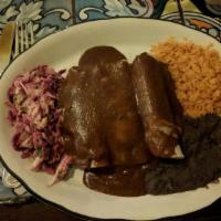 Enchiladas De Mole Poblano - Cheese · Contains nuts. Soft corn tortillas (3) filled with cheese, covered with traditional “mole” s...