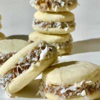 Alfajores · 8 Packs. Cookies, filled with dulce De leche and topped with grated coconut.
