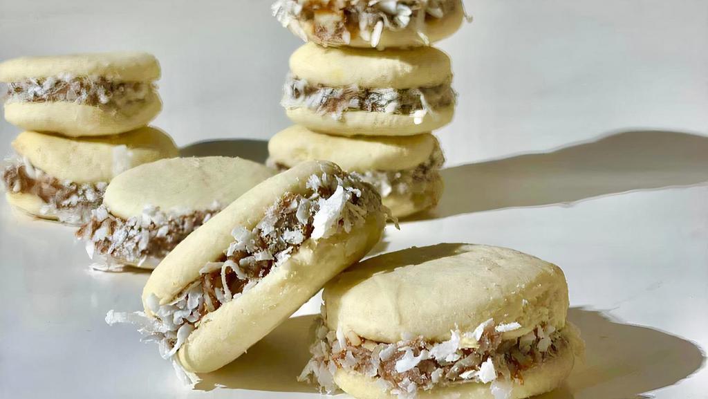 Alfajores · 8 Packs. Cookies, filled with dulce De leche and topped with grated coconut.