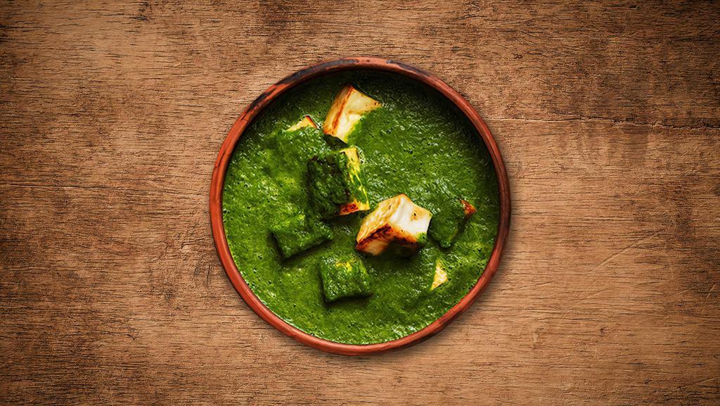 Spinach Cottage Cheese Curry · A combination of spinach and cottage cheese cooked in ginger, garlic and cream-spinach gravy  sauce.