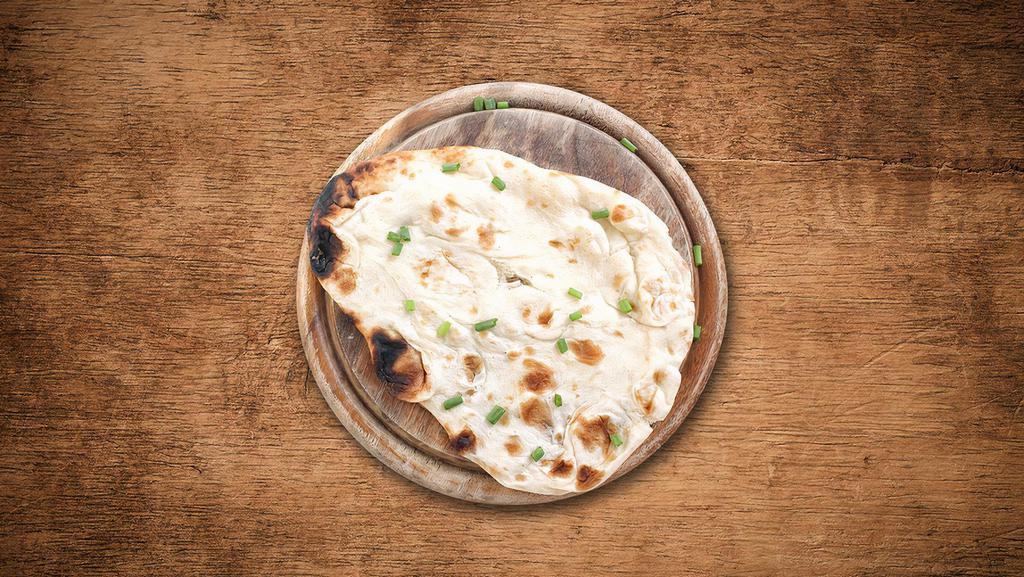 Naan Bread · Indian Bread made with white flour and cooked in Indian clay oven.