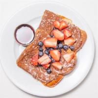 Nutella Stuffed French Toast · Toppings chocolate chips, bananas, blueberries and strawberries.