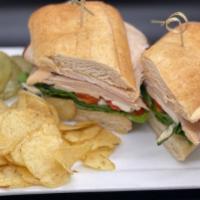 Tuscan Turkey · Sliced turkey, fresh mozzarella cheese, roasted red peppers, spinach and chipotle mayo