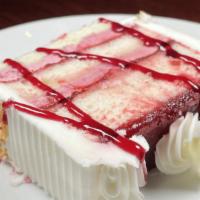 -Montilio'S-  White Chocolate Raspberry Cake · 3 layers of moist white cake, filled with raspberry mousse, topped with butter cream frostin...