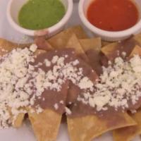 Enchiladas De Pollo / Chicken · Corn tortilla stuffed with chicken, covered with green or red salsa, cheese and sour cream o...