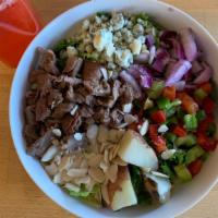 Steakhouse Salad · Romaine, grilled steak, red & green peppers, red onions, bleu cheese, red bliss potatoes, al...