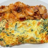 Greek Omelette · Made with six eggs, spinach, tomatoes and feta cheese. Served with home fries and toast.