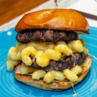 Mac & Cheeseburger · Black Angus Beef topped with Mac & Cheese on a Brioche Bun.