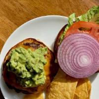 Guacamole Burger · Black Angus Beef topped with Guacamole, Tortilla Chips, Pepper Jack Cheese, Lettuce, Tomato,...