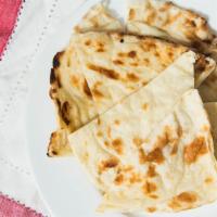 Butter Naan · Soft leavened white bread.