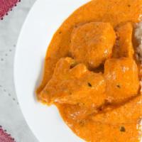 Chicken Tikka Masala · Boneless chicken baked tandoori style and sautéed in a tomato herb sauce with cream and butt...