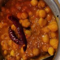 Chana Masala · Garbanzo beans cooked in a tomato and onion gravy.