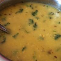 Tarka Dal · Yellow lentils cooked in ginger garlic sauce.