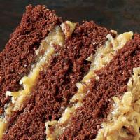 German Chocolate Cake · The BEST German Chocolate Cake with layers of coconut pecan frosting and chocolate frosting....