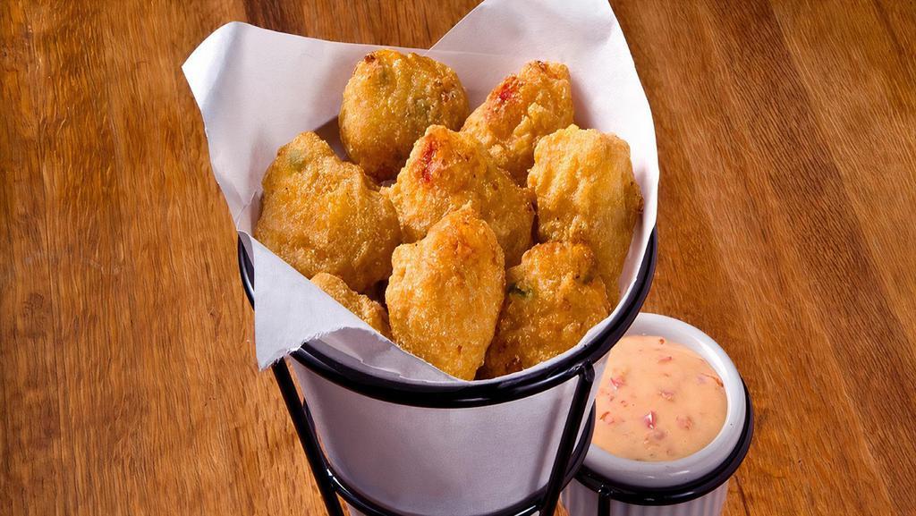 Sweet Corn Nuggets · Southern style corn nuggets, whole corn kernels and creamed corn, into balls, then dipped in a tasty, seasoned batter and fried to perfection.