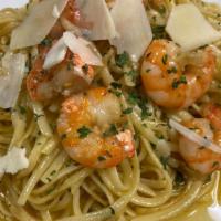 Garlicky Shrimp Scampi · Jumbo Gulf Shrimp, pan seared in garlic butter cream sauce on top of linguine.