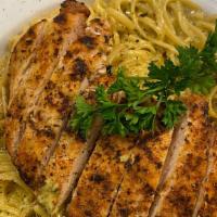 Grilled Chicken Pesto Pasta · Boneless chicken grilled and pan seared in our homemade pesto sauce sautéed spinach and then...