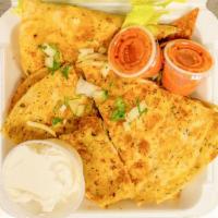 Chicken Quesadilla Platter · Cooked tortilla filled with cheese and folded in half. Served with rice black beans, and sal...