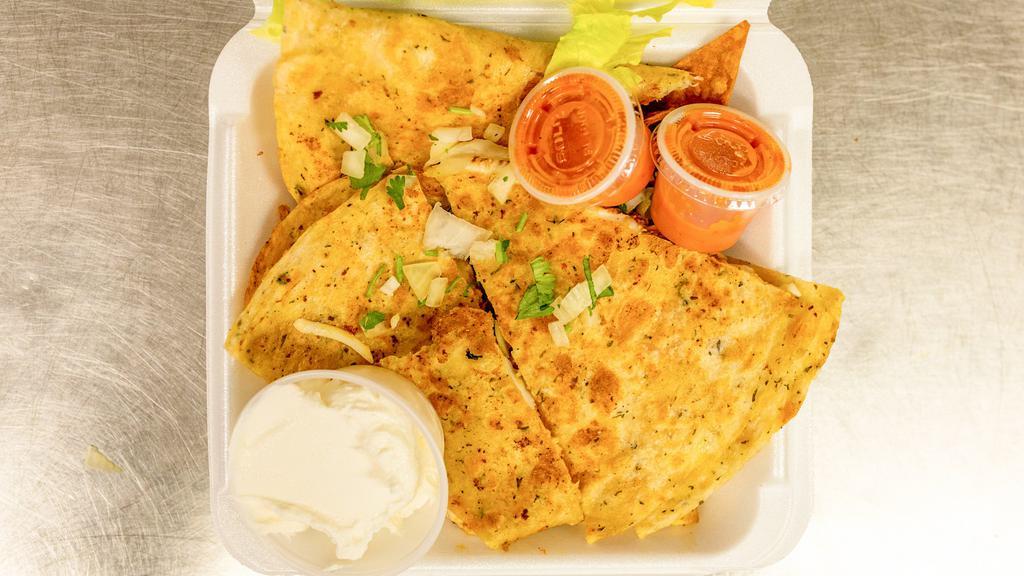 Chicken Quesadilla Platter · Cooked tortilla filled with cheese and folded in half. Served with rice black beans, and salad.