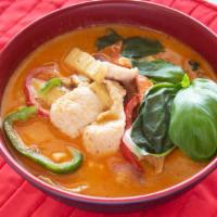 Kaeng Ped Red Curry 红咖喱 · Spicy(can not do mild). Bamboo shoots, coconut milk, bell peppers, lemon leaves and basil.