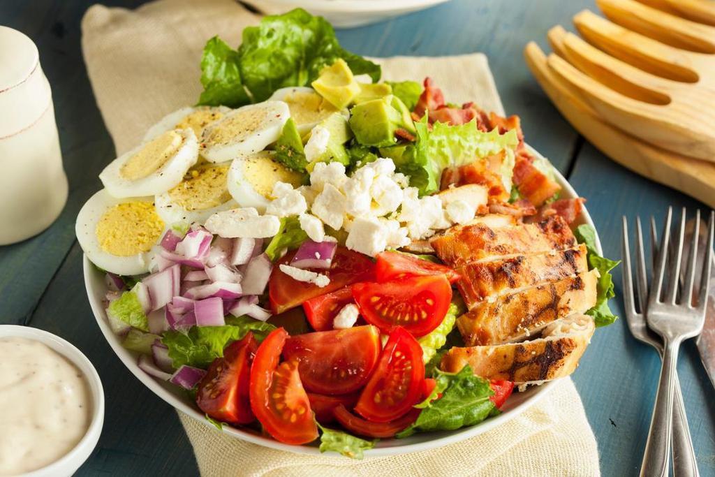 Cobb Salad · Romaine lettuce, avocado, bleu cheese crumbs, bacon, grilled chicken, hard boiled egg, tomatoes, onions, cucumbers and carrots.