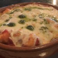 Gnocchi Sorrentina · Homemade potato gnocchi, plum tomato sauce, mozzarella, and baked in a terracotta bowl with ...