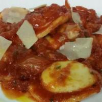 Ravioli Tre Formaggi · Three cheese stuffed ravioli, parmigiano, pecorino, ricotta, and in a tomato sauce.