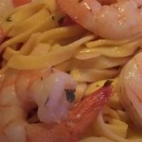 Gamberi Al Limone · Tagliolini tossed with shrimp, roasted garlic, fresh tomato, and fresh lemon.