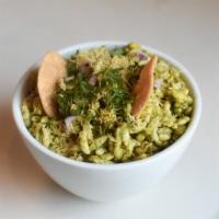 Bhel Puri · Puffed rice, raw mango, and mint cilantro. Chutneys served on the side to preserve crispiness.