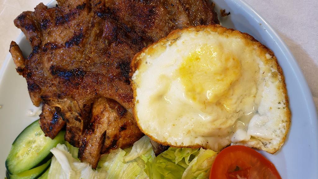Grilled Pork-Chop · Served with fried egg, steamed rice and house salad.