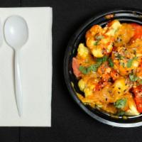 Aloo Gobi · Cubed potatoes and cauliflower cooked with spices and herbs.
