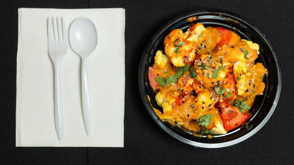 Aloo Gobi · Cubed potatoes and cauliflower cooked with spices and herbs.