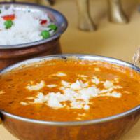 Dal Makhani · Black lentils cooked overnight on a very slow fire flavored with butter, tomato, fenugreek e...