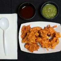 Mixed Pakora · Assorted fried vegetable fritters with cauliflower, onion, potato and spinach.