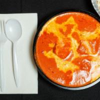 Tikka Masala · Ground whole peeled tomato, cream, and butter sauce.