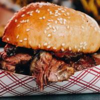Brisket Sandwich · smoky texas-style sliced brisket on a sesame seed bun with our house-made barbecue sauce. se...