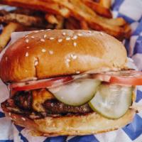 The Standard Burger · a classic burger, topped with cheese, pickles, onions, tomatoes, and our burger sauce. serve...