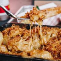 Mac & Cheese · a decadent, cozy mix of four cheeses and elbow macaroni.