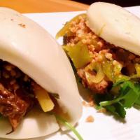 2 Gua Bao Taiwanese Hamburger · Gua Bao pork bun, stewed pork belly, pickled cabbage, peanuts and cilantro.