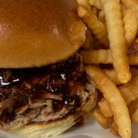 *Pulled Pork Sandwich · 6 oz of Smoked Pulled Pork served on toasted Brioche Roll with your choice of sauce.