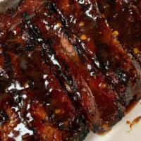 *1/2 Slab Platter · 1/2 Slab of Smoked Pork Ribs your choice of sauce. Served with your choice of 1 side.