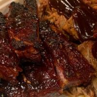 *1/2 Slab W/ Brisket · 1/2 Slab of Pork Ribs & 4 oz of Beef Brisket served with your choice of sauce and 1 side.