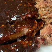 *1/2 Slab W/ Pulled Pork · 1/2 slab of pork ribs & 4 oz of pulled pork served with your choice of sauce and 1 side.