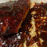 *1/2 Slab W/ Pulled Chicken · 1/2 slab of pork ribs & 4 oz of pulled chicken served with your choice of sauce and 1 side.