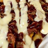 *Meat & Potatoes · Seasoned fries topped with your choice of pork, chicken, or brisket your choice of sauce and...