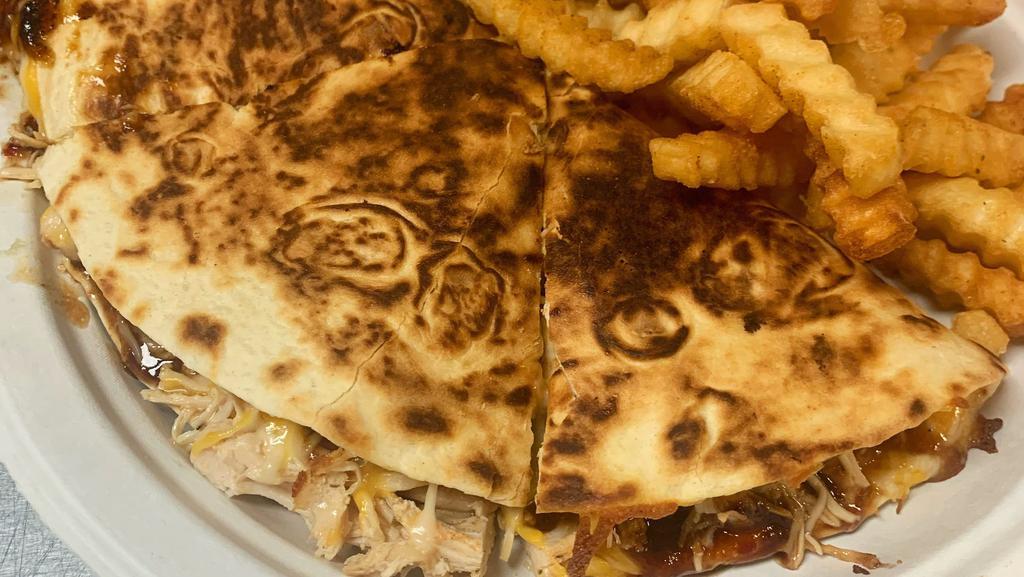 *Chicken Quesadilla · Grilled quesadilla filled with smoked all white meat pulled chicken, cheddar jack cheese and your choice of sauce. Served with seasoned fries.