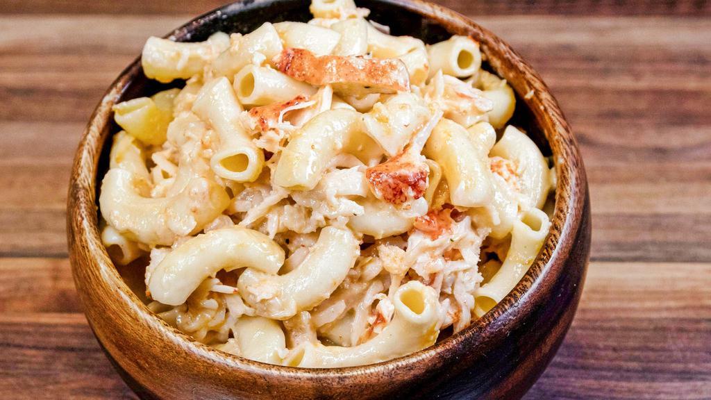 Lobster Mac & Cheese · Our homemade lobster mac & cheese is ooey and gooey, full of cheese and real lobster meat that melt in your mouth.