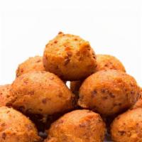 Hush Puppies · Delightfully deep-fried and perfectly seasoned, with whole kernels of corn in the batter. A ...